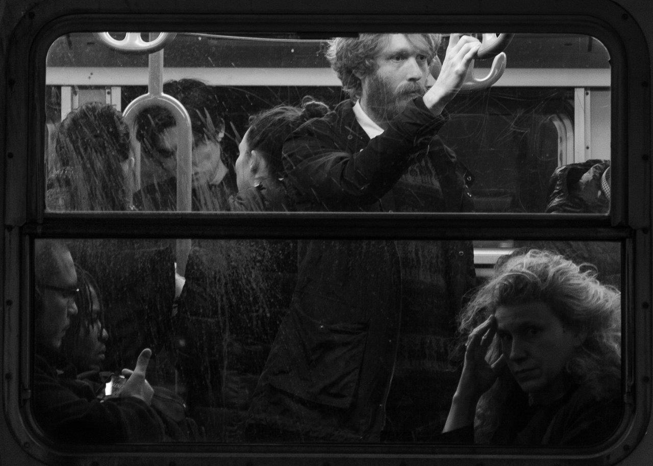 people on a tram outside the state library of victoria melbourne
